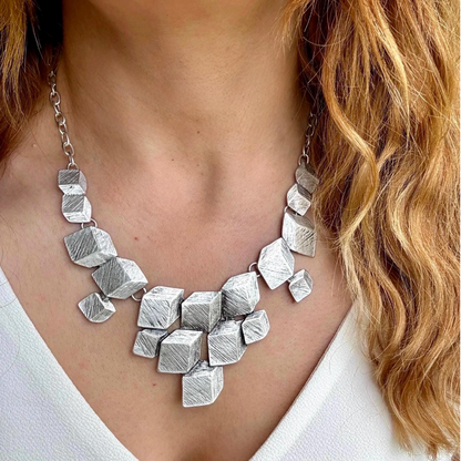 Industrial Sophistication: Featuring a high-quality silver finish and a sturdy chain, this necklace combines edgy industrial vibes with classic elegance.