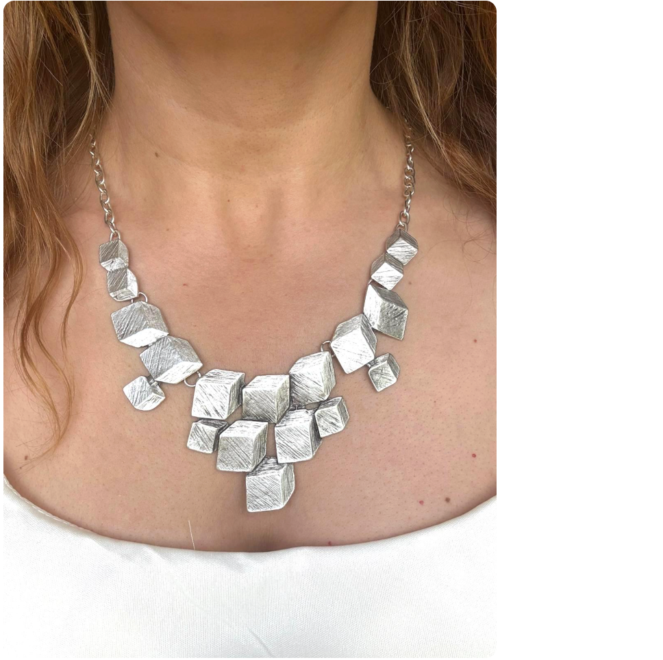 Versatile Chic: Elevate your white tee or little black dress. This silver-tone chunky necklace adds a sophisticated industrial touch to both casual and formal looks.